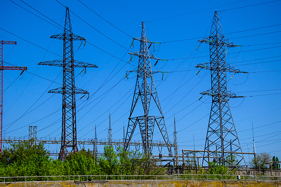 high-voltage-power-lines-and-towers-against-blue-s-2026-03-26-03-29-27-utc